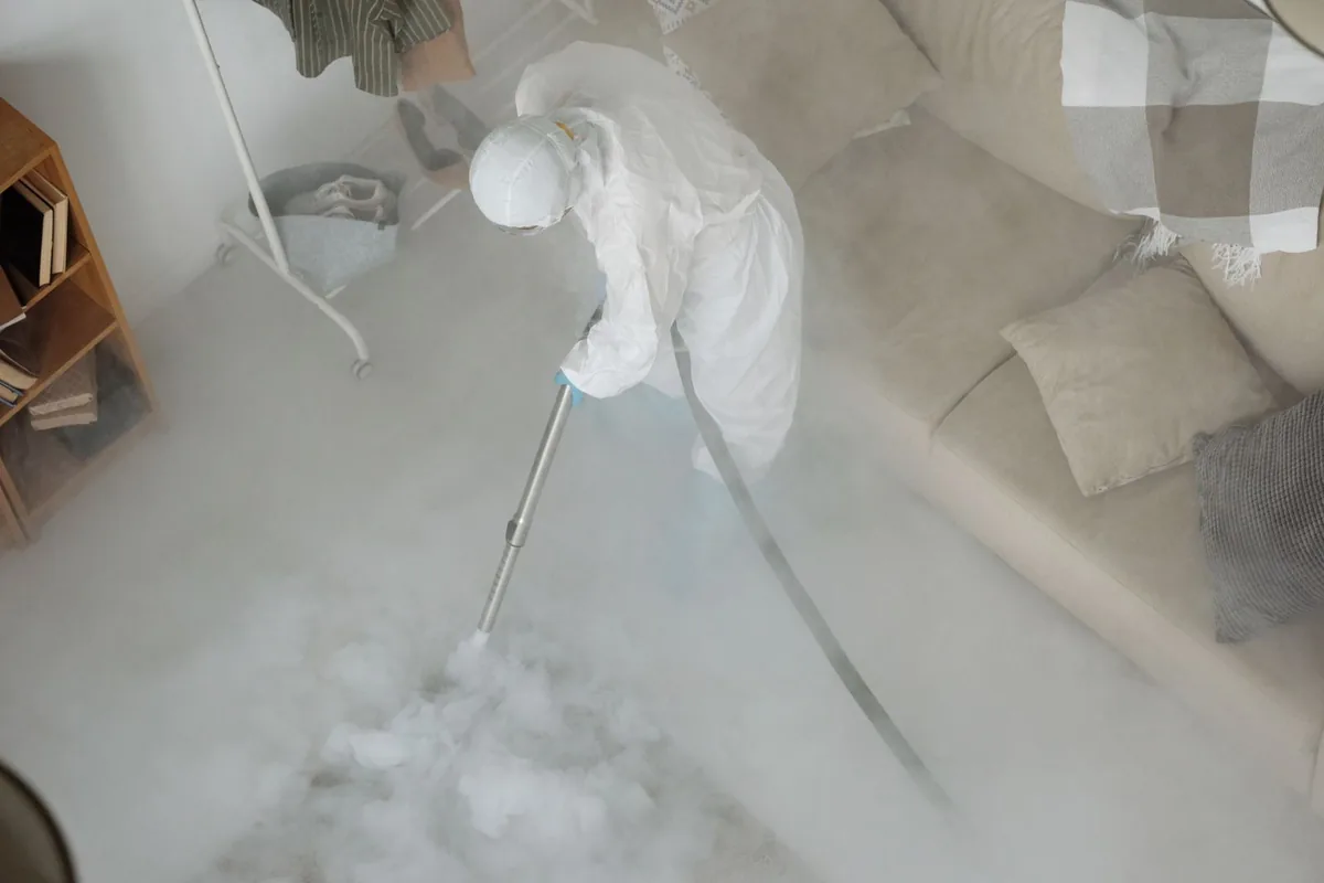 Biohazard cleanup technician in protective equipment, Elizabeth, CO